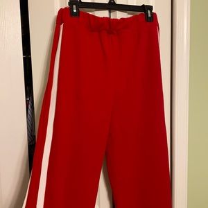Red pants with white side stripe detail